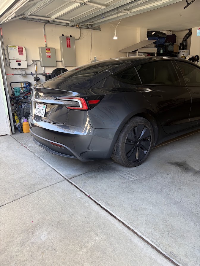 Same Tesla Model 3 rear quarter and bumper finished, colour-matched and glossy