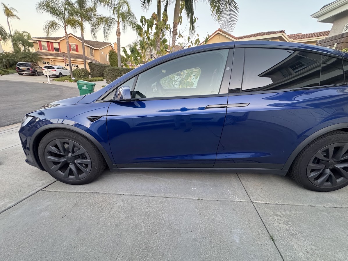 Deep Blue Tesla Model Y side panels after mobile bodywork