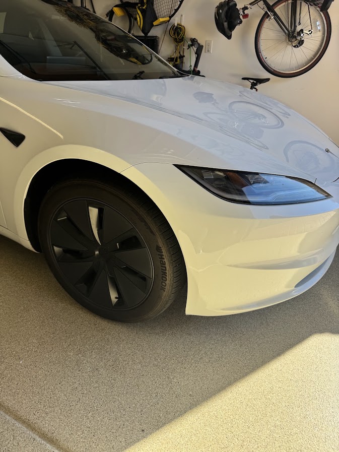 Same white Tesla Model 3 bumper corner smoothed, repainted and blended